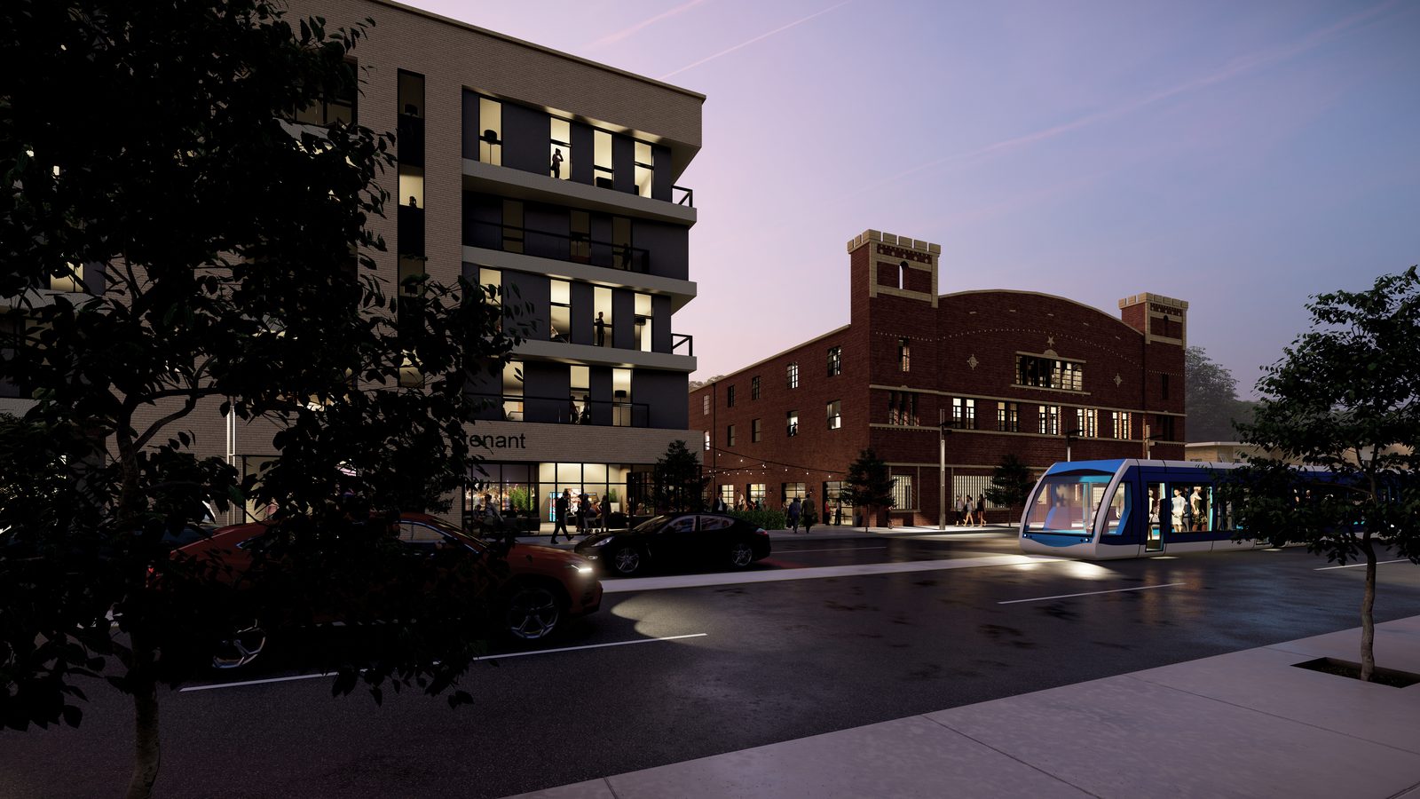 The same block at dusk, new construction and the restored armory facing Main Street