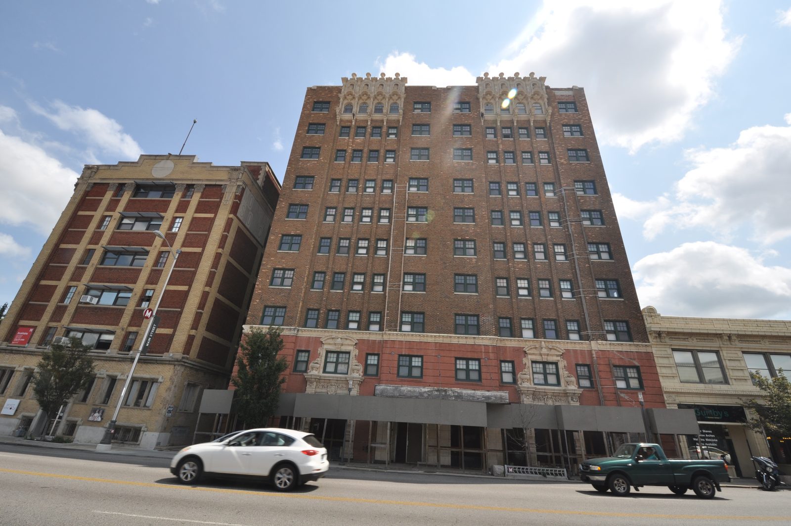 The boarded storefronts at 39th and Main before the rebuild